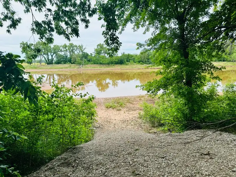 River access from Rivershire — lush green trees framing the Salt Fork River