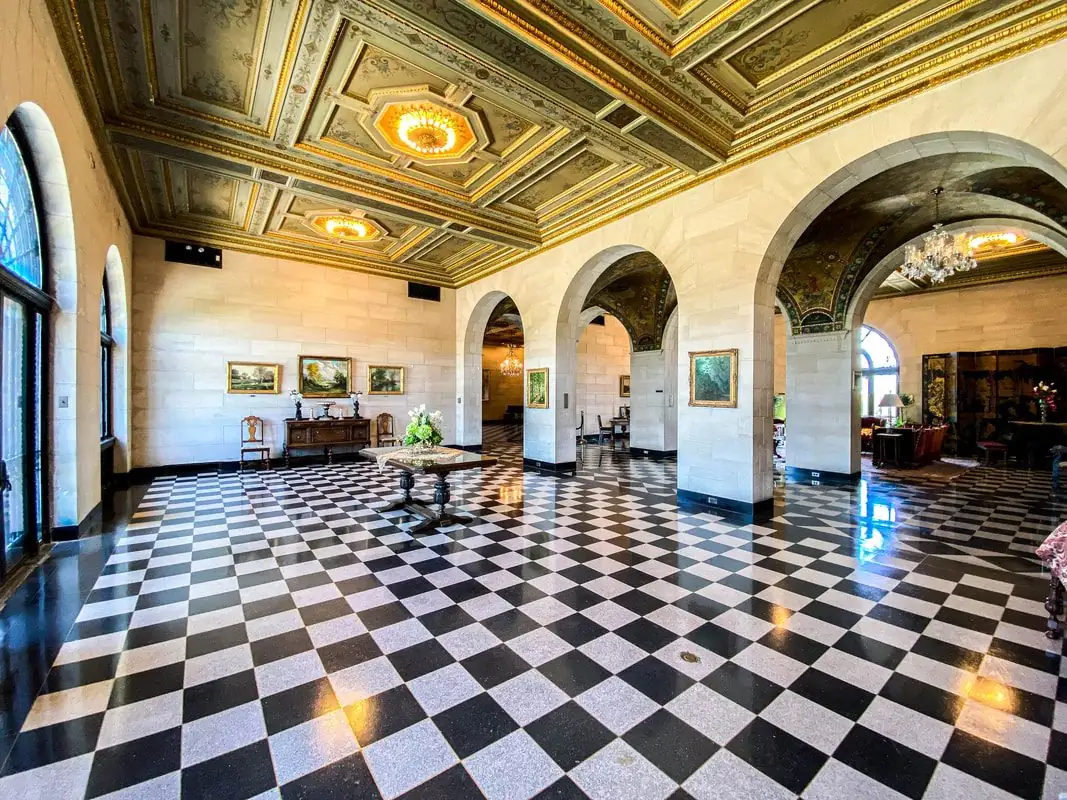 Grand ballroom with ornate gilded ceiling at Marland Mansion