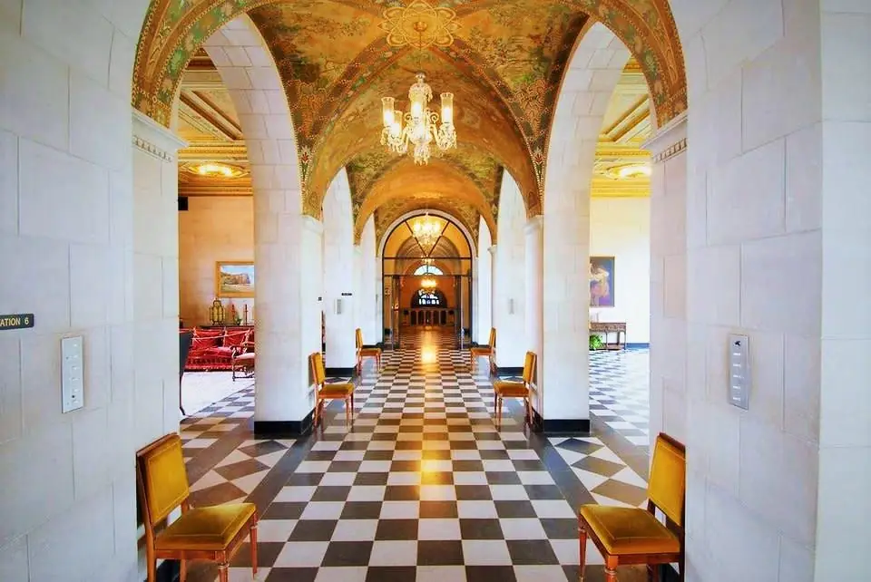 Grand corridor with painted vaulted ceiling inside Marland Mansion