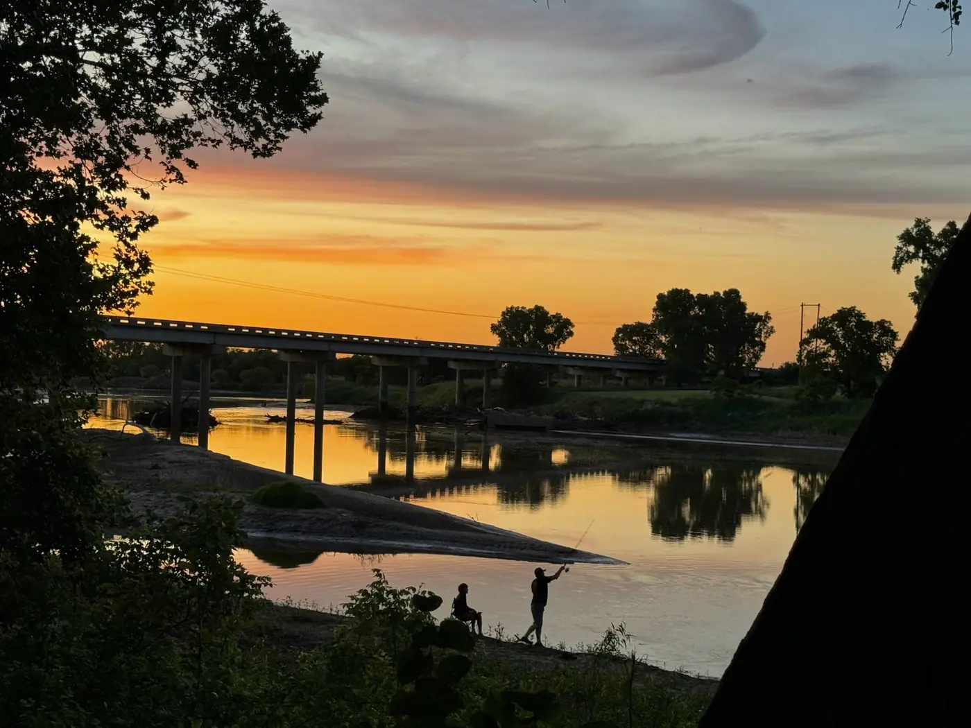 Golden sunset over the Salt Fork River at Rivershire RV Resort